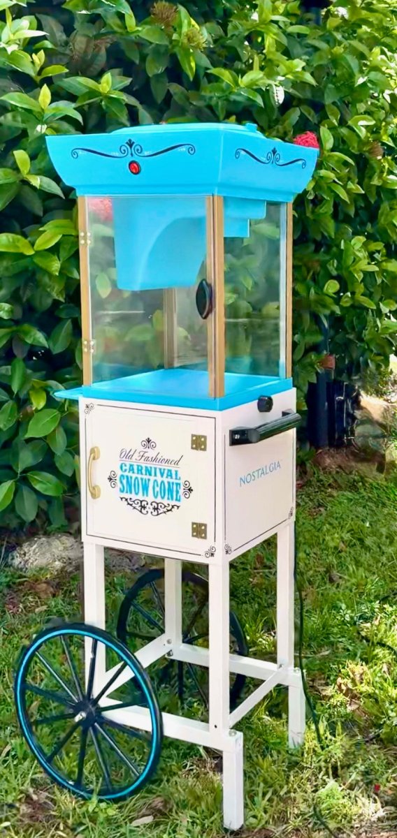 Tabletop snow cone machine on a blue cart for kids birthday parties
